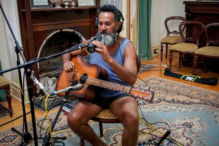 Ashley Smith during the recording of his song on the WA music project in the Hoover House dining room.