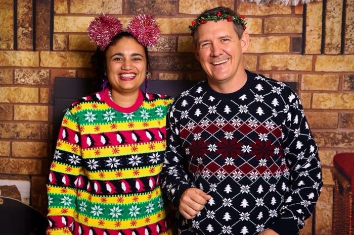 NT Tourism Minister Lauren Moss and Chief Minister Michael Gunner in festive Christmas jumpers