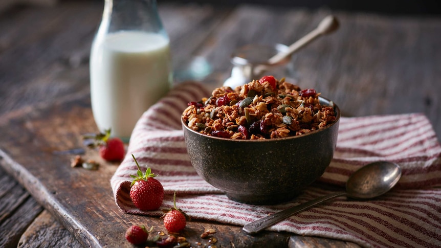 Toasted muesli in a bowl with milk.