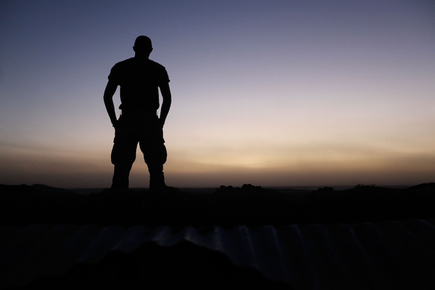 A US marine looks out over the the Helmand River in Kajaki, Afghanistan.