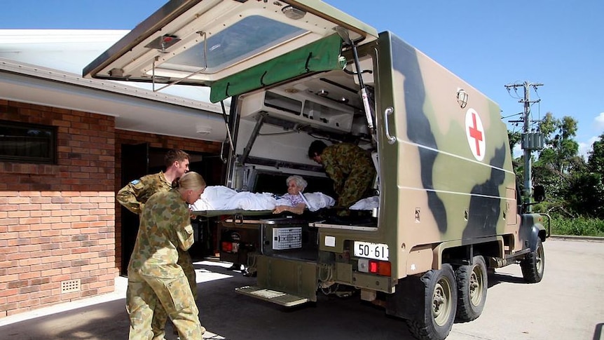 The army evacuate residents from Garden Settlement Retirment Village in Townsville
