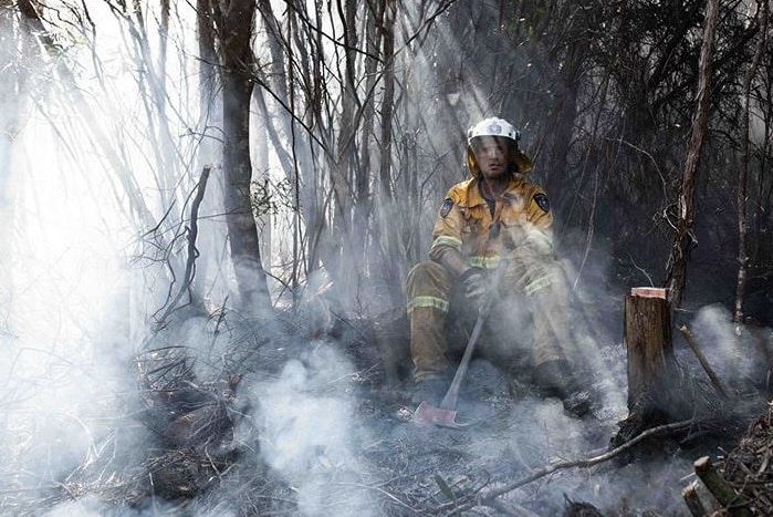Firefighter takes a break during Tasmanian bushfires.
