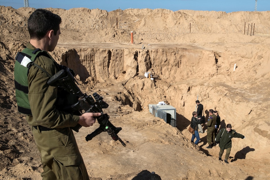 An Israeli soldier keeps guard next to an entrance of an underground tunnel.