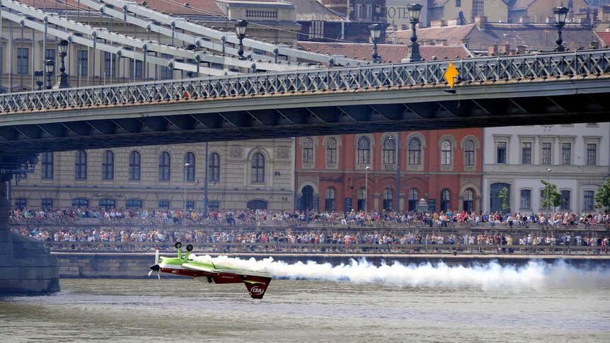 Zoltan Veres flies his aircraft under the Chain Bridge.