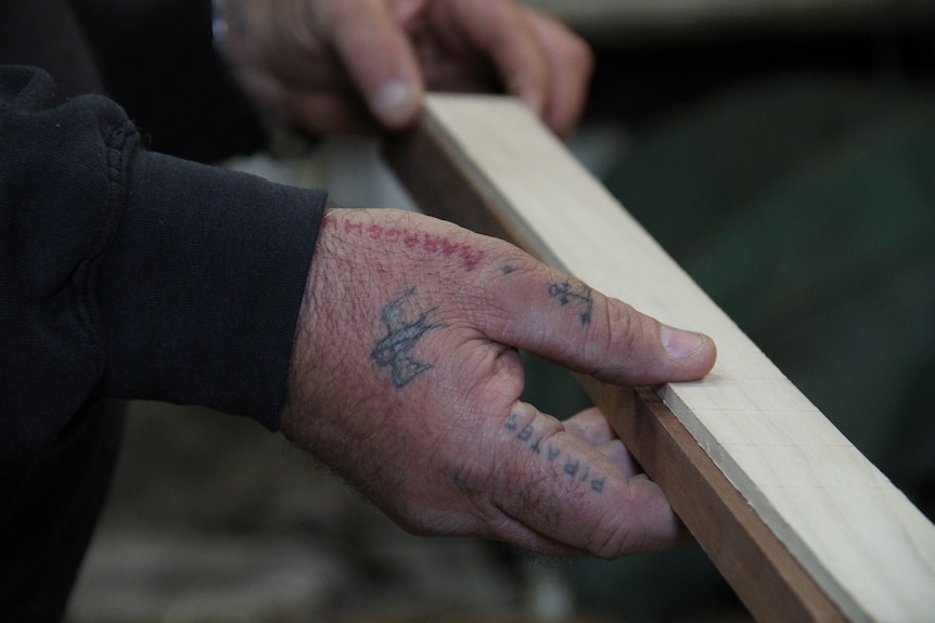 Phil eyeing a new guitar neck.