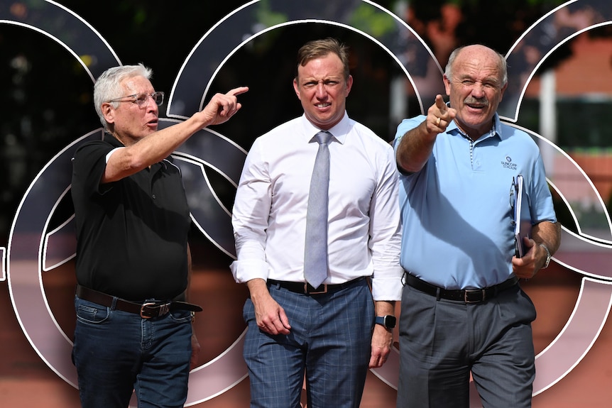 Suncorp general manager Alan Graham, Premier Steven Miles and former rugby league great Wally Lewis in front of Olympics rings.