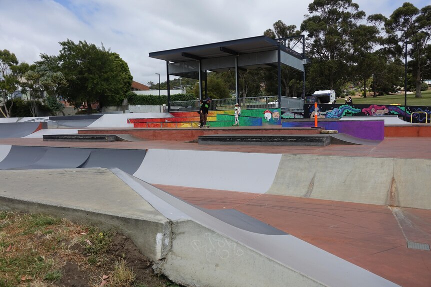 image of skate park with graffiti and ramps