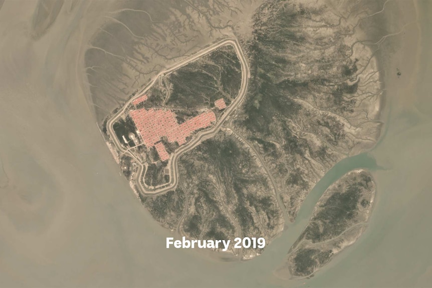 A satellite image showing roads and red roofs of houses appearing on a small island