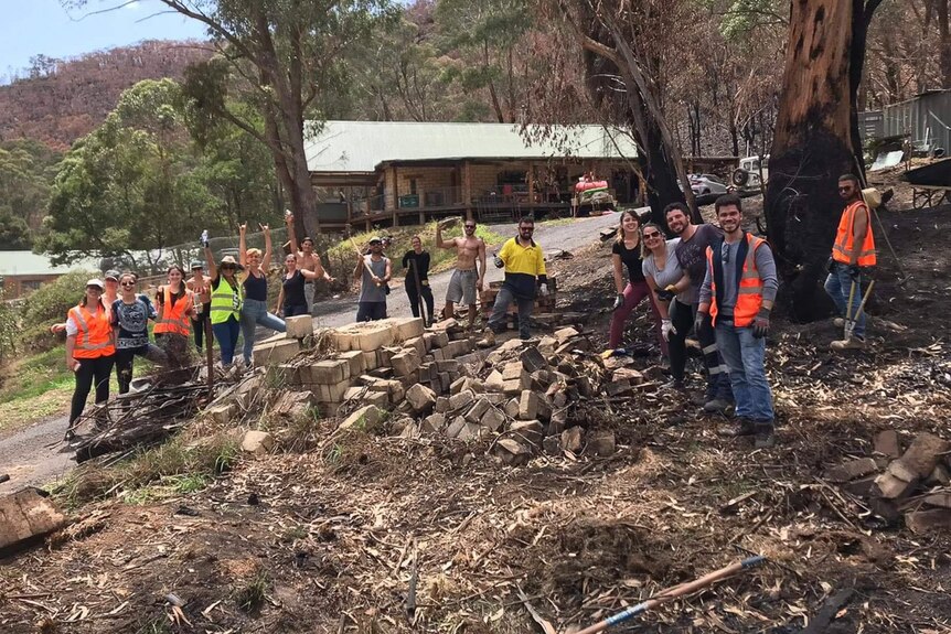 Volunteer workers on a bushfire-damaged site.