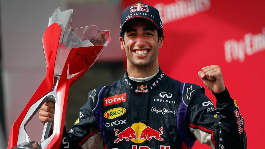 Australia's Daniel Ricciardo celebrates with the trophy after winning the Canadian F1 Grand Prix.