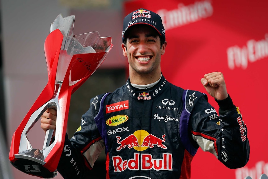 Australia's Daniel Ricciardo celebrates with the trophy after winning the Canadian F1 Grand Prix.