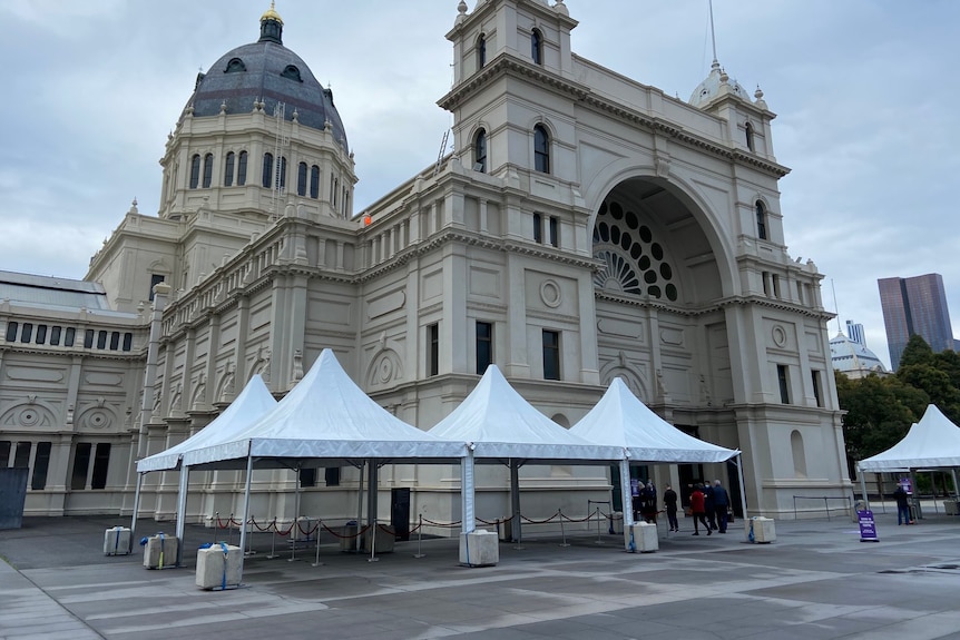 The Royal Exhibition Building with a section roped off for a COVID vaccination line