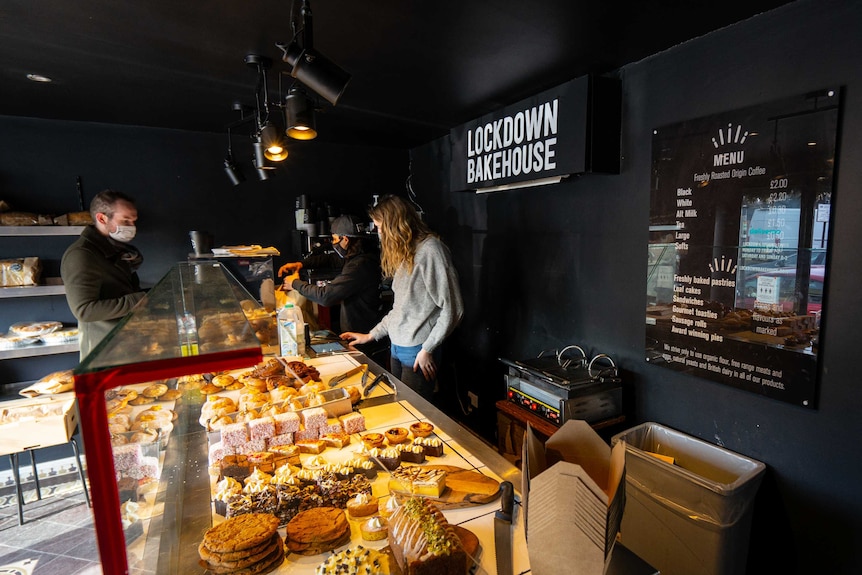 A customer inspects the baked goods at the Lockdown Bakehouse in London.