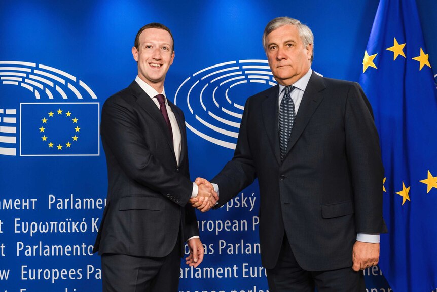 European Parliament President Antonio Tajani, right, shakes hands with Mark Zuckerberg