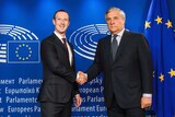 European Parliament President Antonio Tajani, right, shakes hands with Mark Zuckerberg