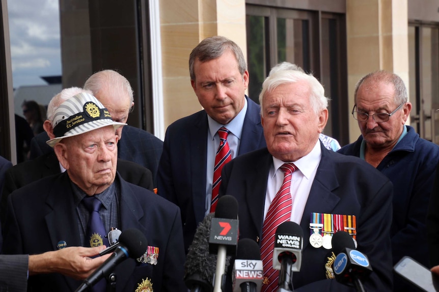 Ray Whitby with his son, state Labor MP Reece Whitby, and fellow survivor Jim Marlow outside WA Parliament.