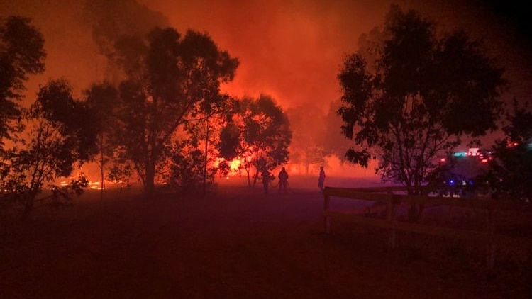 Red flame sky at the scene of the Eagle Bay bushfire.