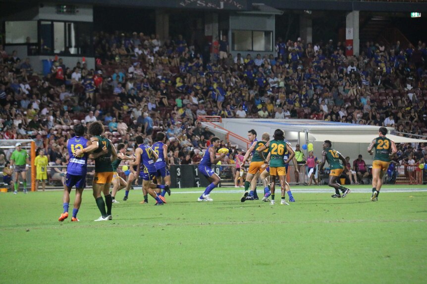 Players from both St Marys and Wanderers Eagles on the field during the AFLNT grand final 2017.