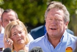 Andrew Forrest and his wife Nicola talk at a press conference.