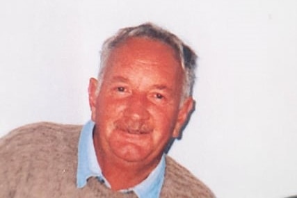 photo of a man in his 60s with a white moustache