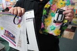 child holding a fake insulin pump and sheet explaining the rules of the 48 hour challenge