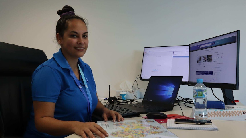 Telstra call centre team leader Thecla Brogan at her desk.