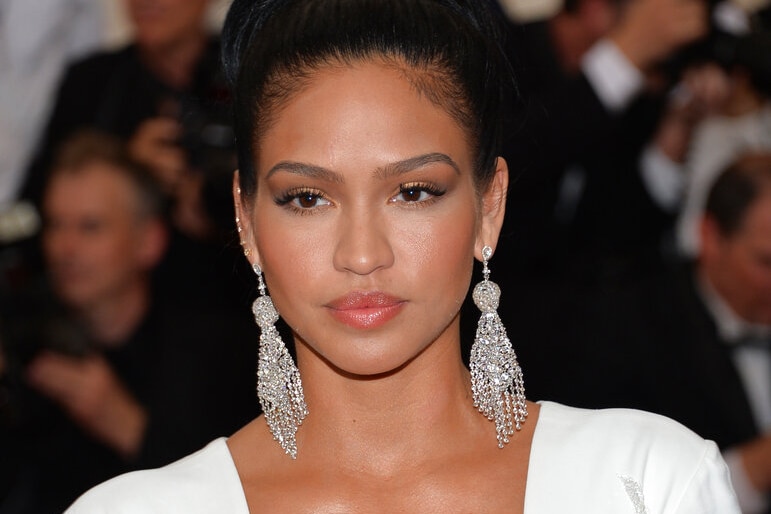 Cassie Ventura wearing large sparkling earrings and a neutral expression on the red carpet.