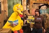 Big Bird looks sad as he waits for a taping to start.