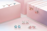 Images of diamond jewellery on the pink boxes