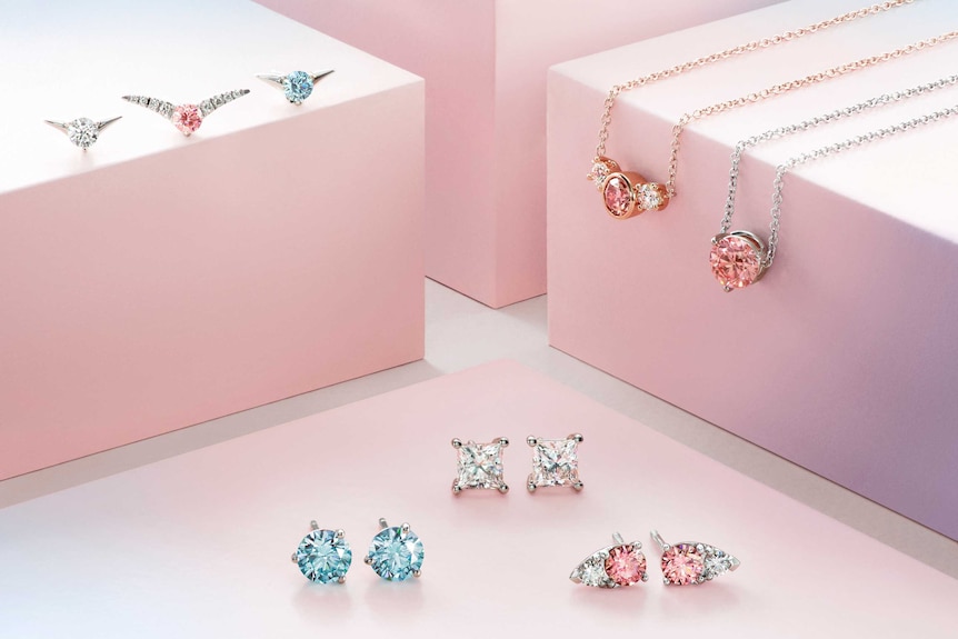 Images of laboratory-grown diamond jewellery on pink boxes