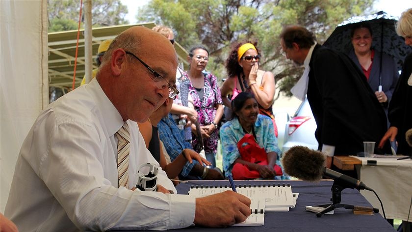 Paul Caica signs the native title deal in the Riverland