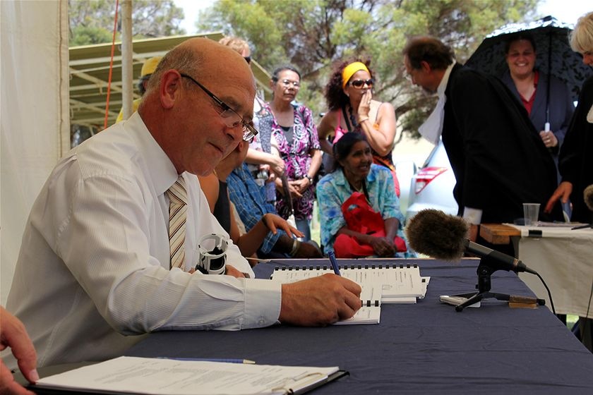 Paul Caica signs the native title deal in the Riverland