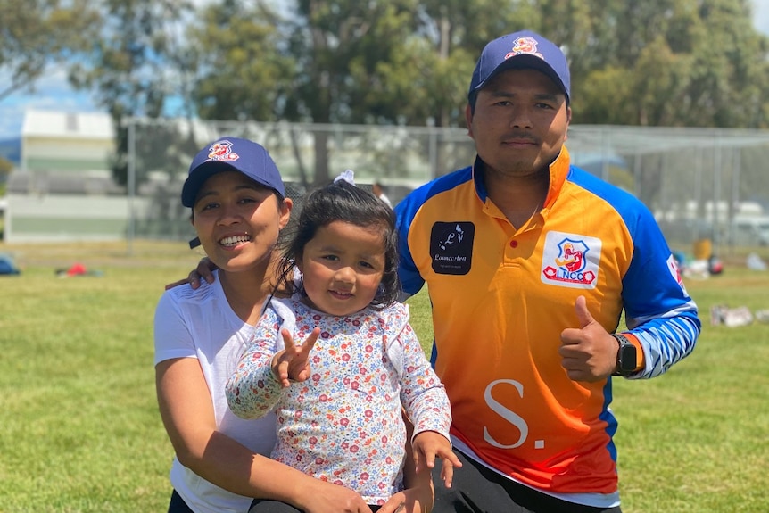 Nepalese migrants watch cricket in Launceston