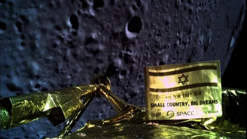 The gilded strut of a lunar landing spacecraft can ben seen in the foreground, with the surface of the Moon seen prominently.