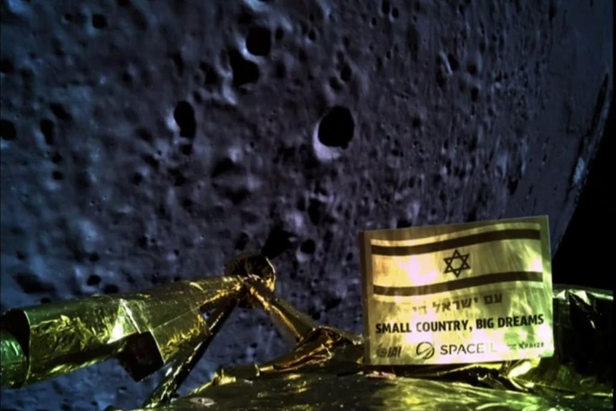 The gilded strut of a lunar landing spacecraft can ben seen in the foreground, with the surface of the Moon seen prominently.