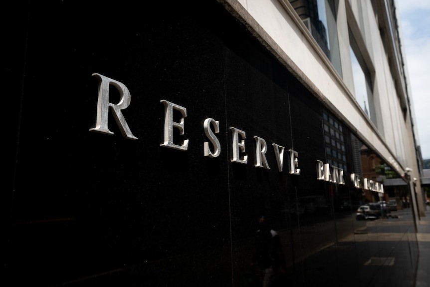 A sign saying "Reserve Bank of Australia" on the exterior wall of the RBA headquarters in Sydney