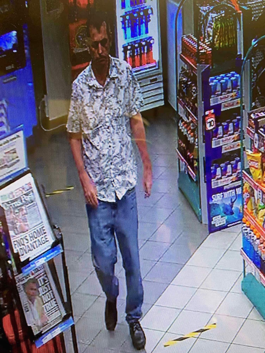 CCTV image of a man walking into a petrol station convenience store.