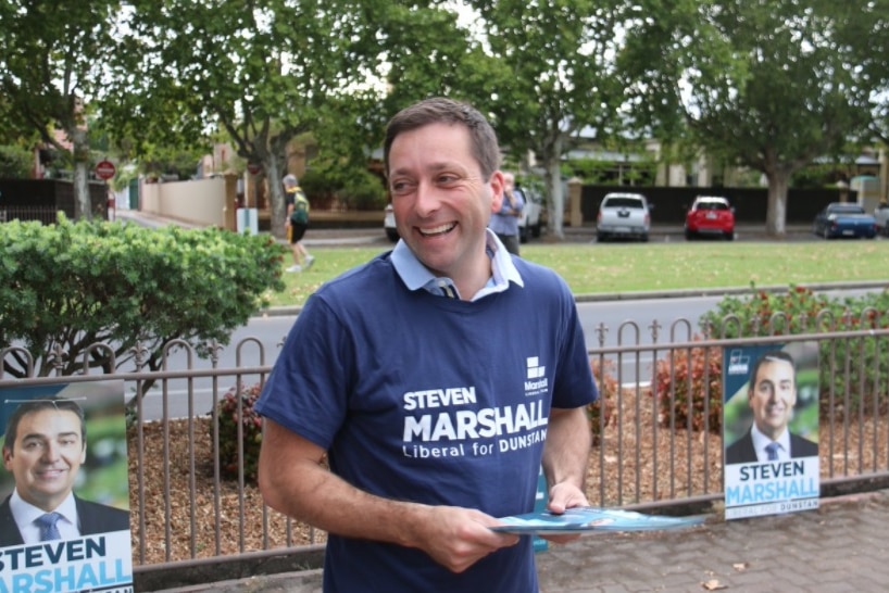 Victorian Liberal leader Matthew Guy in a blue t-shirt and smiling.