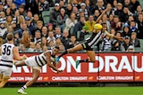 Collingwood's Travis Varcoe fights for the ball