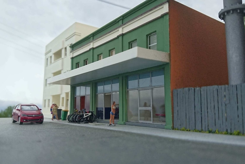 A miniature model of a commercial building strip.