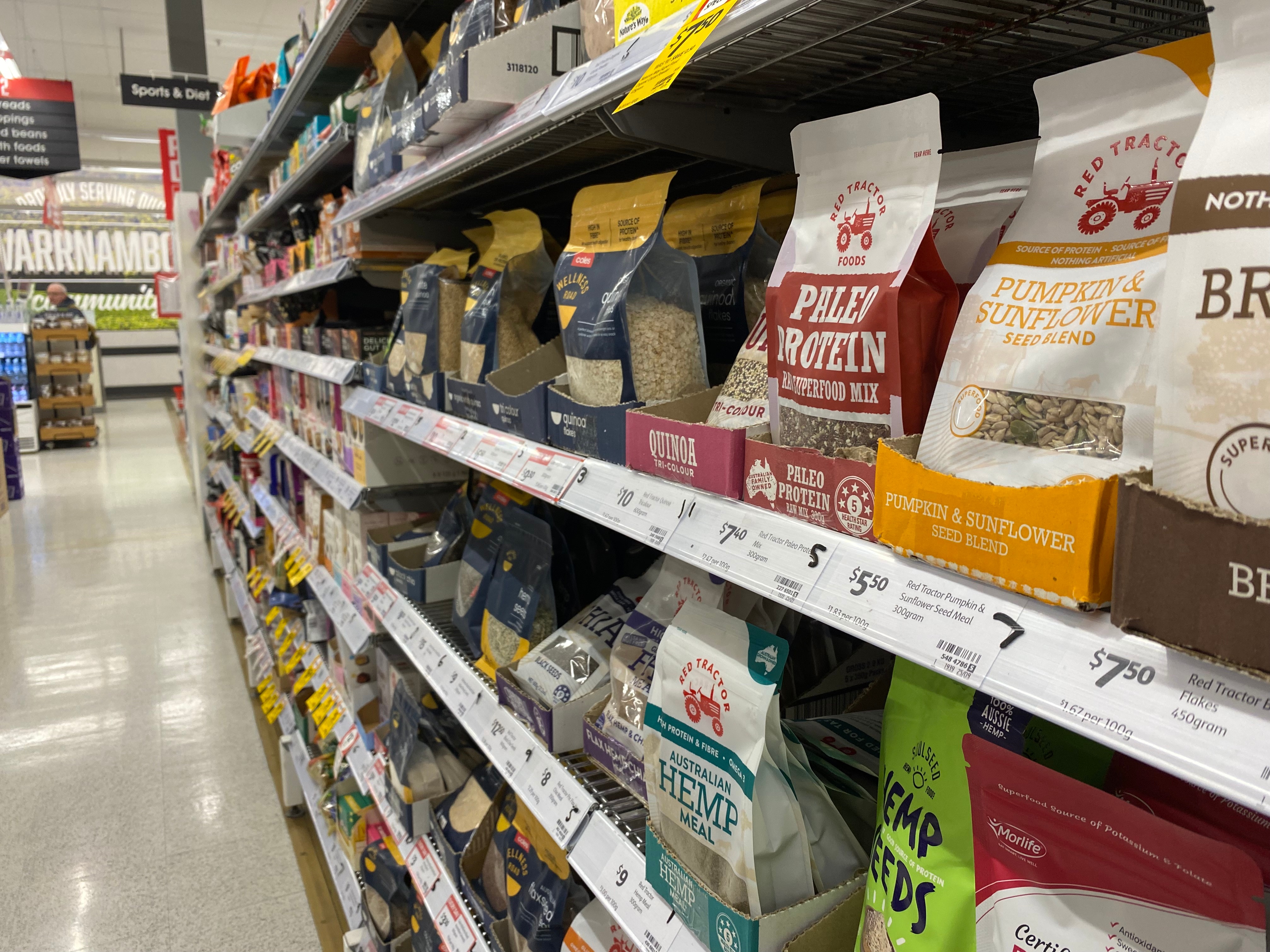 The health food aisle at a chain supermarket with superfoods for sale.