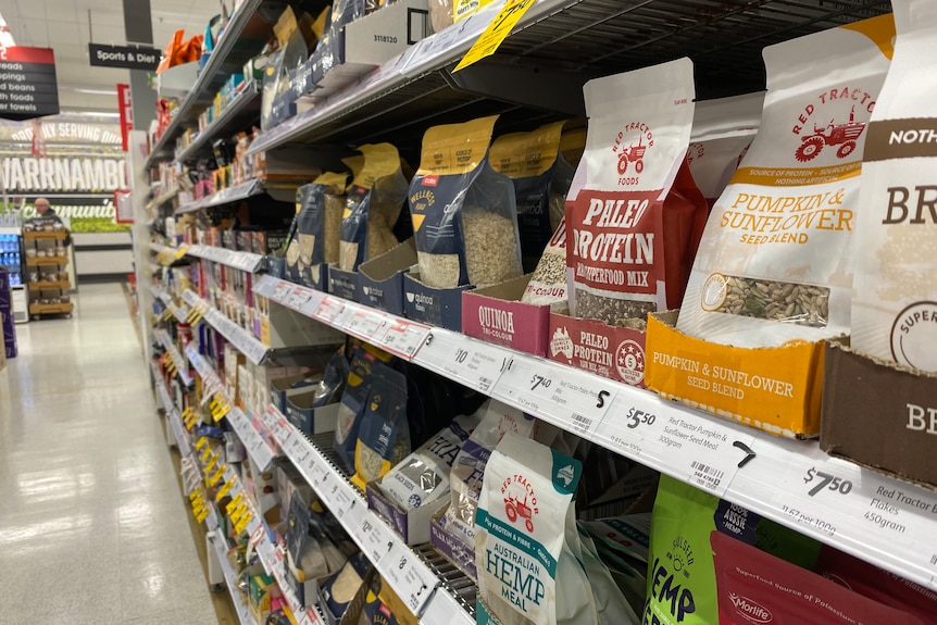 The health food aisle at a chain supermarket with superfoods for sale.