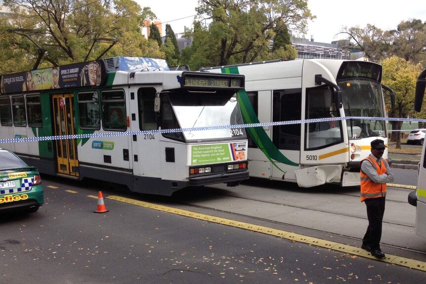 A tram has collided with a car in Parkville