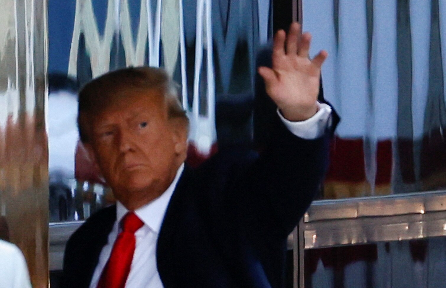 Donald Trump arrives in New York ahead of arraignment as supporters and protesters gather outside Trump Tower - Vimarsana News