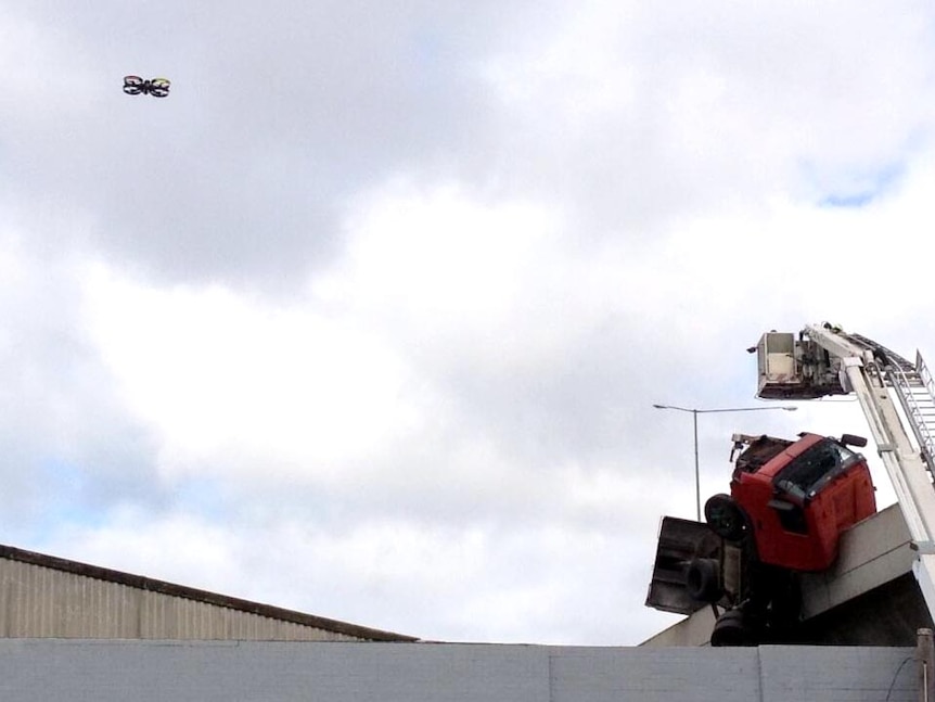 Drone hovers over crash scene on the Bolte Bridge.