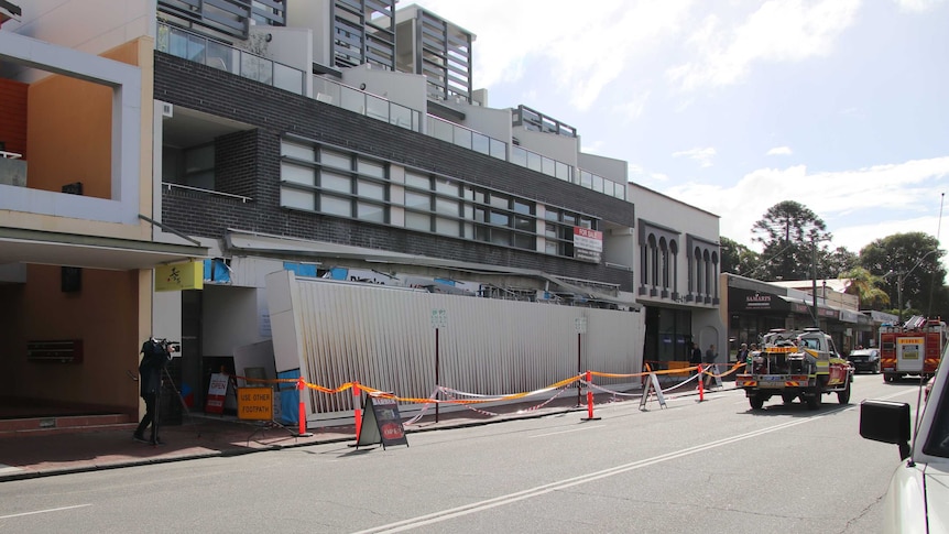 A fallen awning sits on a footpath after falling from a three-storey building on Oxford Street in Mount Hawthorn.
