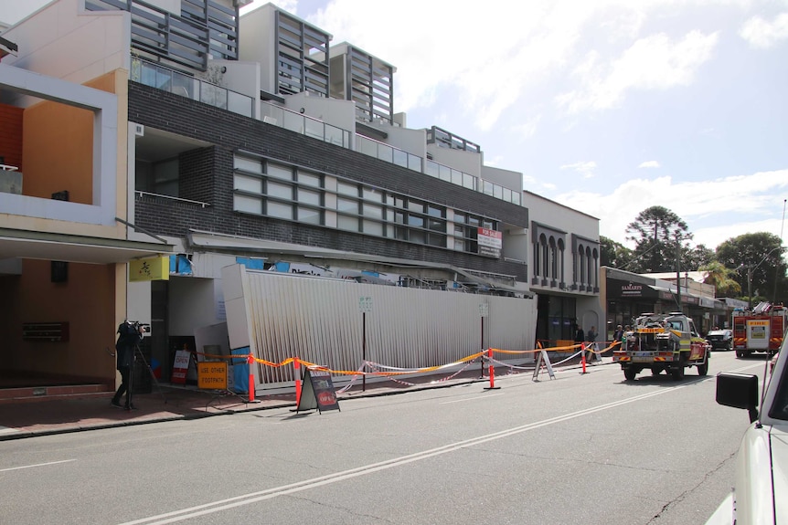 A fallen awning sits on a footpath after falling from a three-storey building on Oxford Street in Mount Hawthorn.