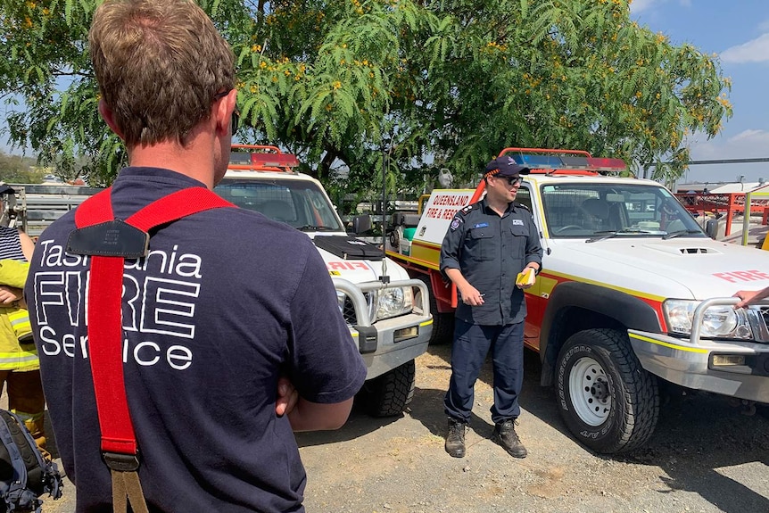 Two firefighters from Tasmania at the incident control centre at Boonah in Queensland.