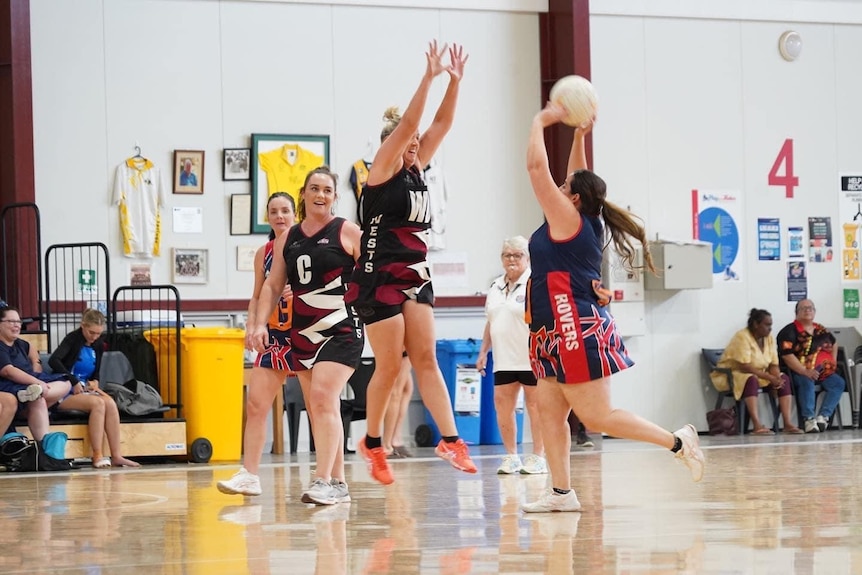 A Rovers player shoots in a netball game