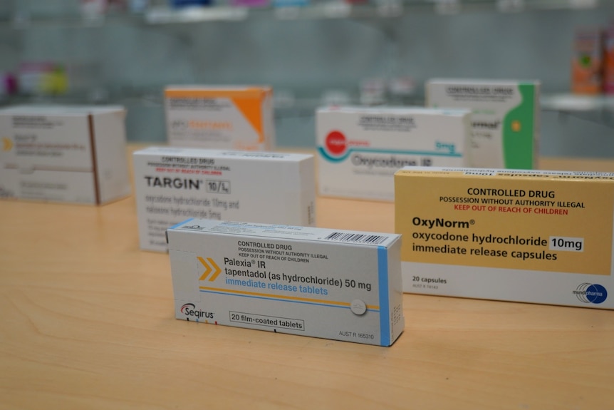 Opioids and other medication on a pharmacy counter.